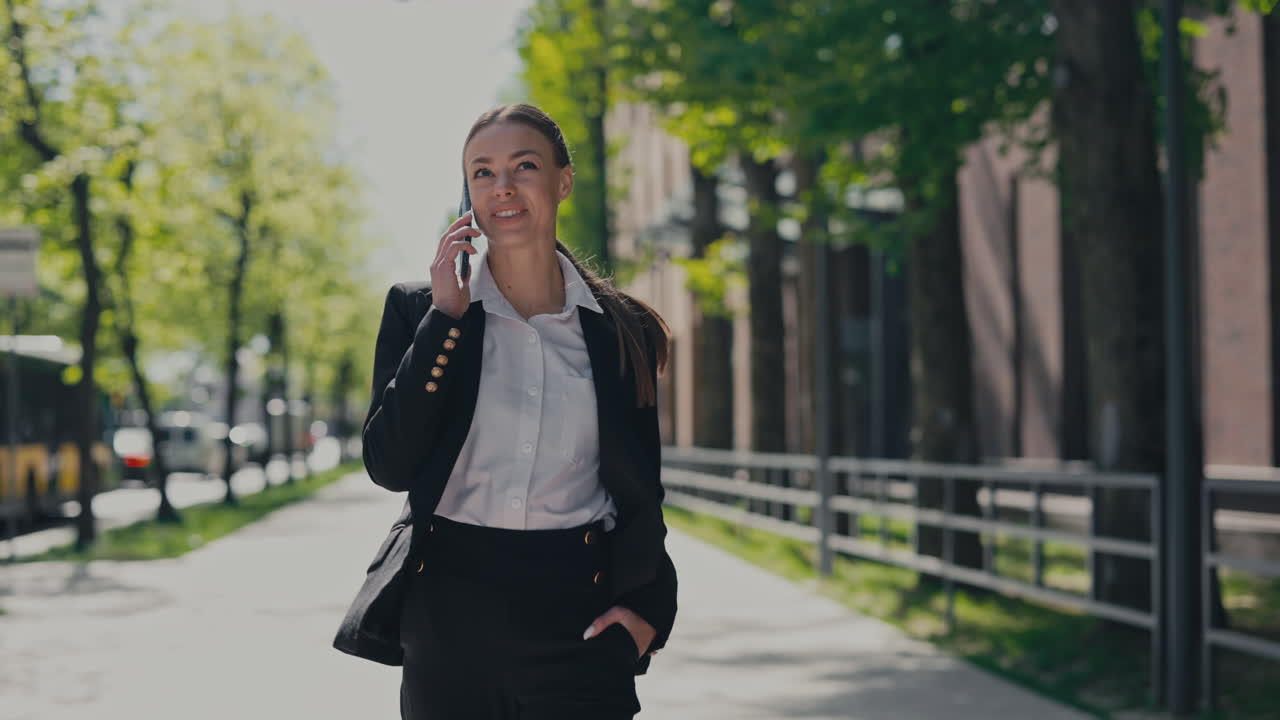Businesswoman on a phone call outdoors