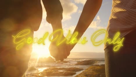 animation of text vibes over people by seaside