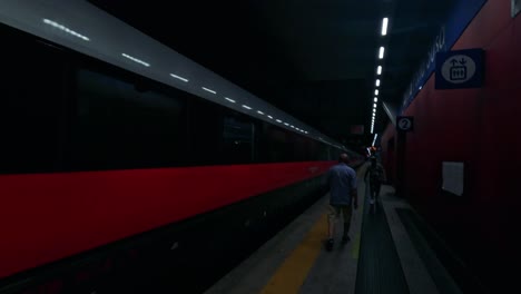 train arrives at platform in turin, italy