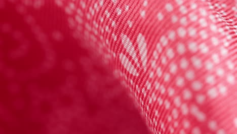 red fabric texture with spots motif