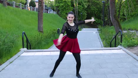 female dancer performs an energizing dance outside