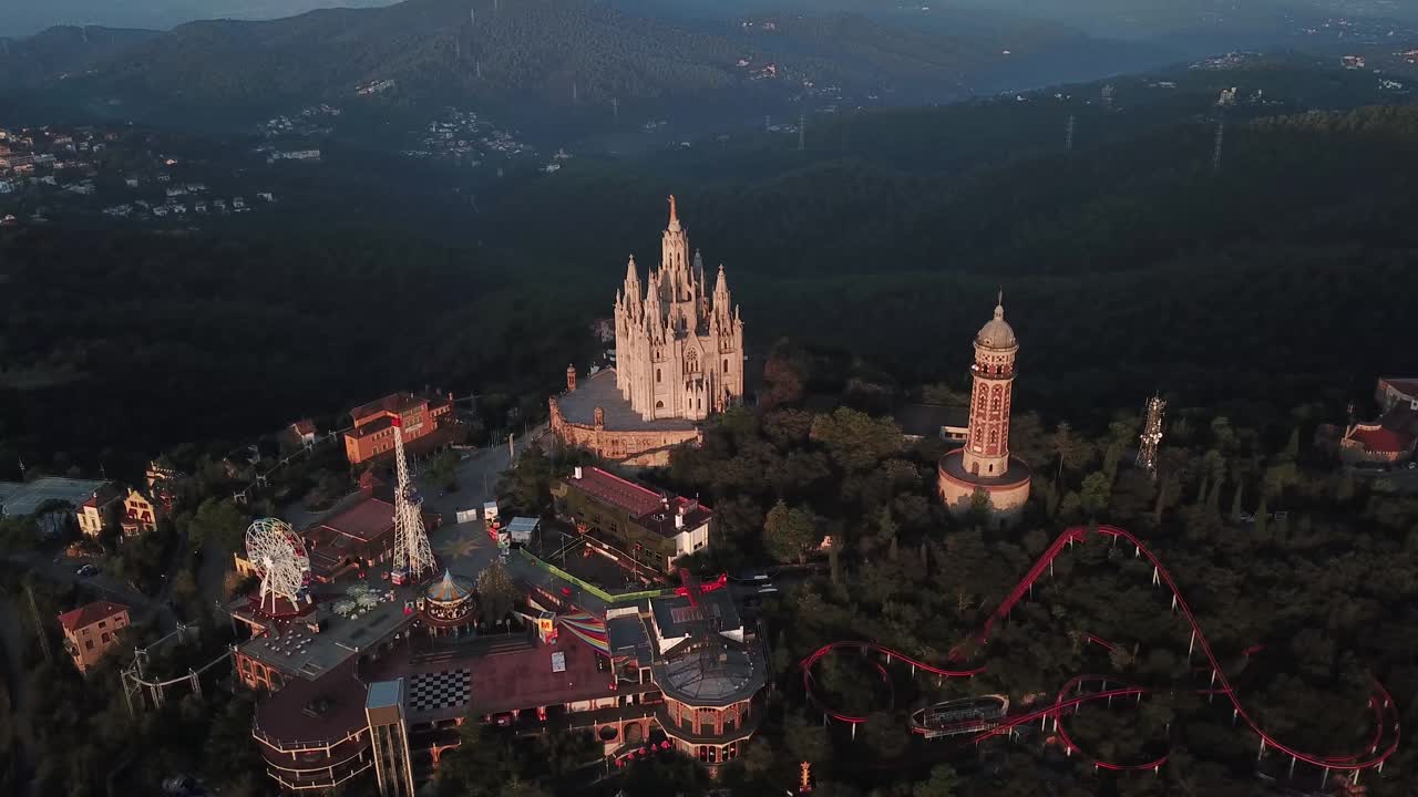 drone shot over tibidabo in Barcelona 4k, jesus christ statue in barcelona