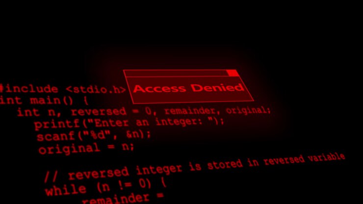 Cybersicherheits-Zugriffswarnung-Visualisierung mit rotem 'Zugriff verweigert'-Label, dunklem Code-Text und eingeschränktem System.