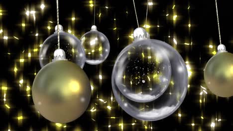 animation of christmas baubles dangling with snow falling and stars on black background