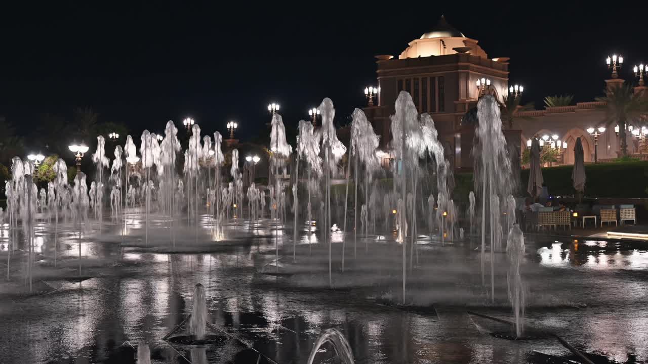 Abu Dhabi’s Emirates Palace Hotel illuminated at night in the UAE