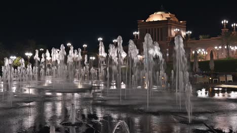 abu dhabi’s emirates palace hotel illuminated at night in the uae