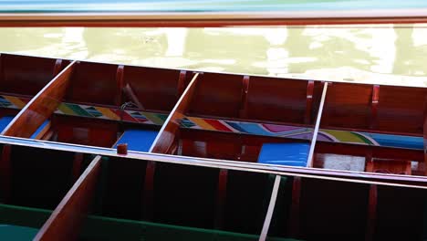 wooden boats docked at a floating market