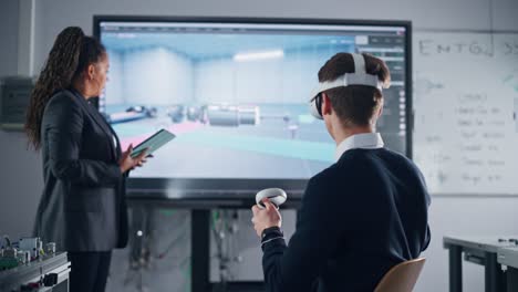 Male Student Wearing VR Headset Moving Controllers while Designs Prototype of Electric Motor Under the Supervision of Black Teacher at University. Futuristic Virtual Design Concept