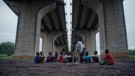 group of african children learning from their teacher under a bridge, symbolizing resilience, hope, and the transformative power of education in challenging circumstances