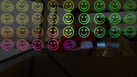 colorful smiley face animation over people sitting in vehicle with drinks