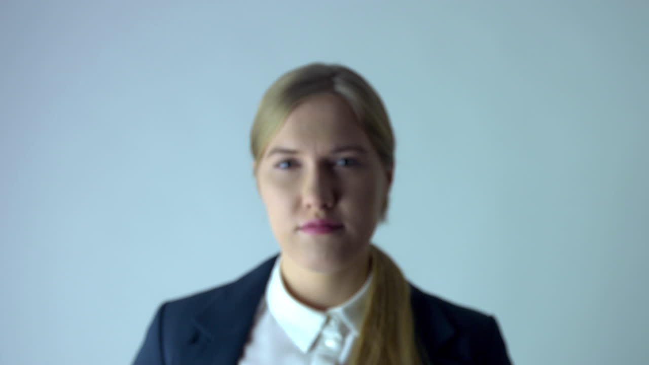 Blurred business woman zoom in effect in focus in professional studio