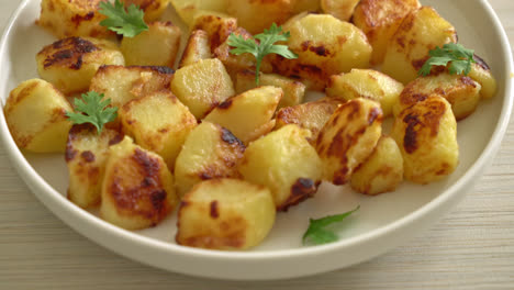 roasted or grilled potatoes  on white plate