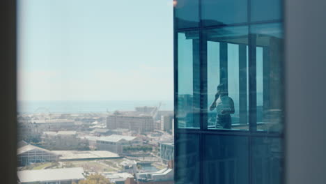 asian-business-woman-using-smartphone-talking-to-client-negotiating-corporate-deal-female-consultant-for-sales-company-having-phone-call-working-in-office-looking-out-window-at-city