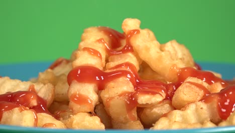 french fries with ketchup on a chroma background