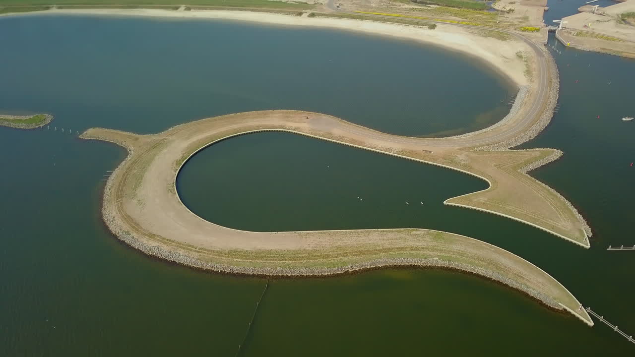Aerial drone shot of the manmade Tulip island which is located at the coastline of Zeewolde, Flevoland, the Netherlands.