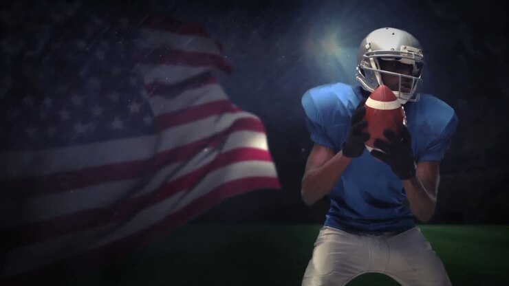 ein amerikanischer fußballspieler, der ernsthaft um den ball kämpft