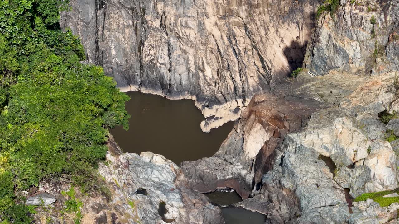 Aerial footage captures the rugged terrain and lush greenery of Barron River Gorge in Port Douglas, Australia