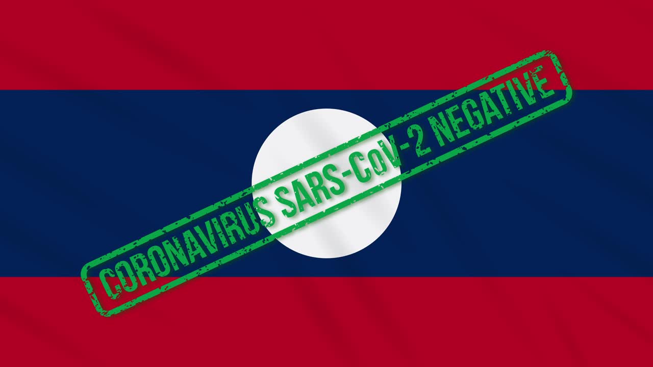 라오스는 코로나 바이러스로부터의 자유의 녹색 스프를 가진 발을 흔들고 있습니다.