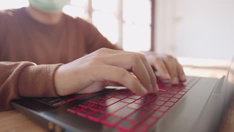 a close-up business man press to type information computer laptop for shopping online at home