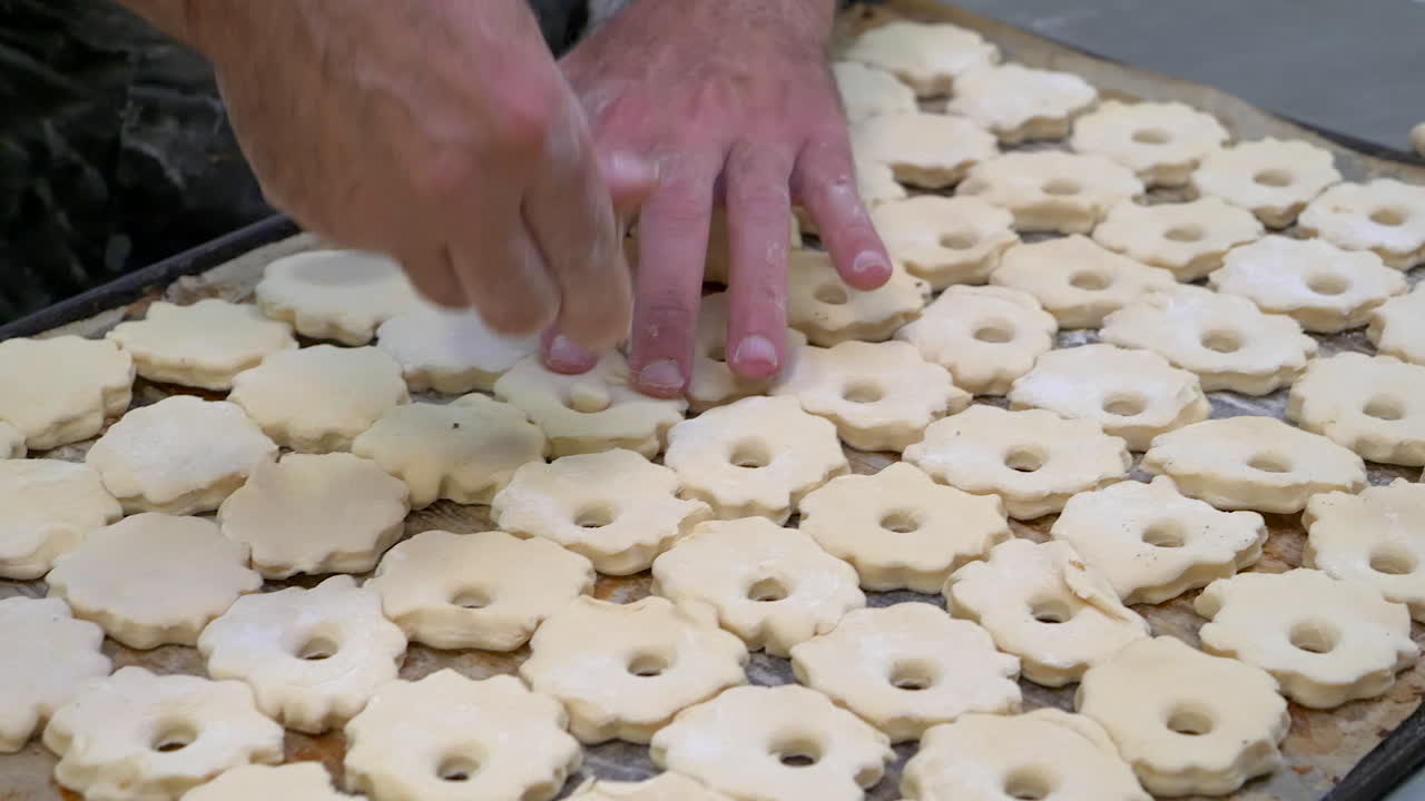 Preparing the raw puff pastry for the oven