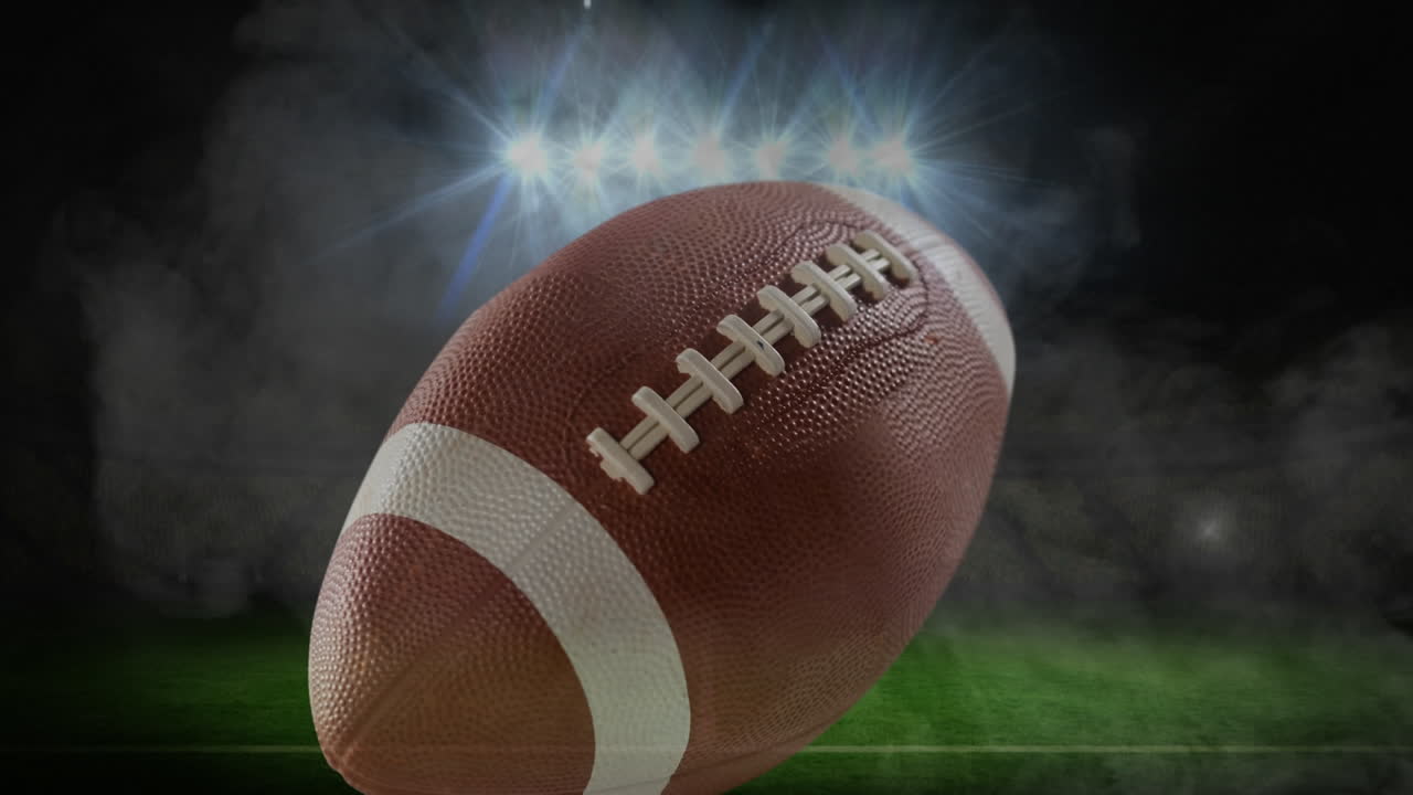 Animazione di palla da football americano su luci dello stadio