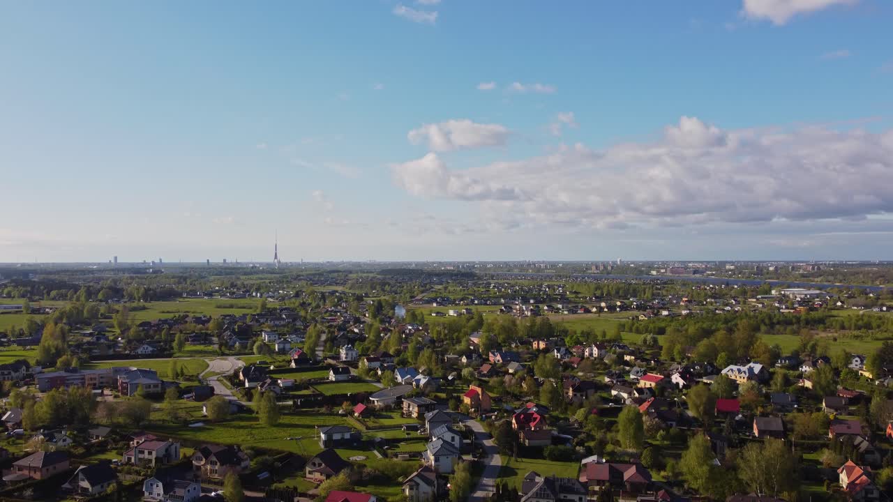 A bright, sunny day in Katlakalns Spring Residential Area, showing a calm, modern neighborhood.
