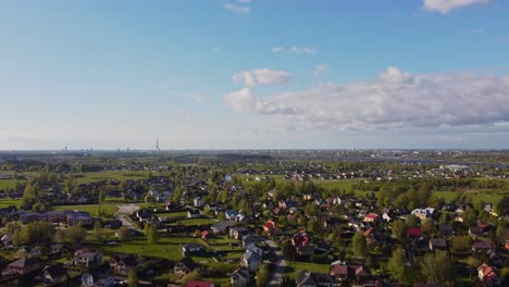 a bright, sunny day in katlakalns spring residential area, showing a calm, modern neighborhood.