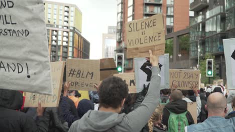 london blm protestors marching and holding signs