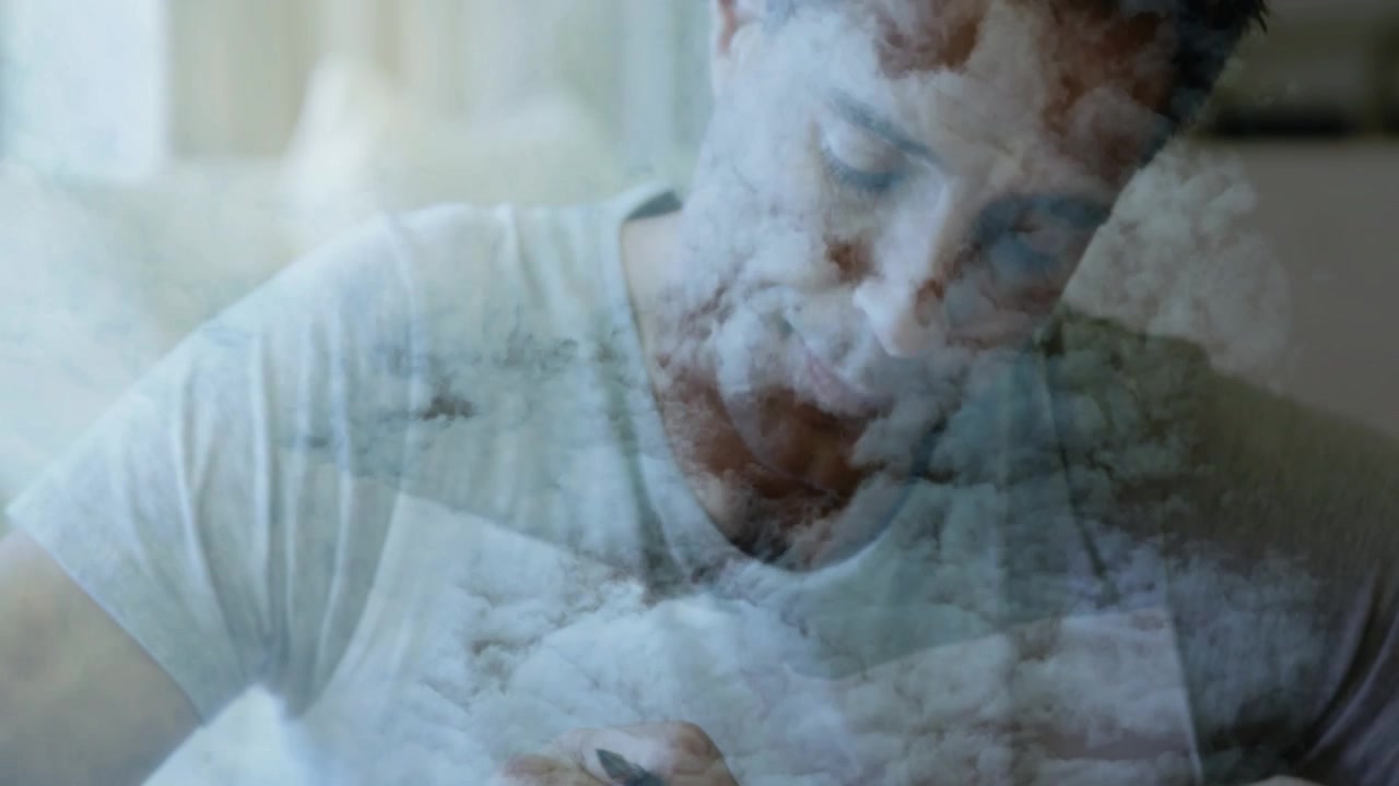 Mature man touching phone, pressing calculator, writing with pen, finance cloud overlay blending