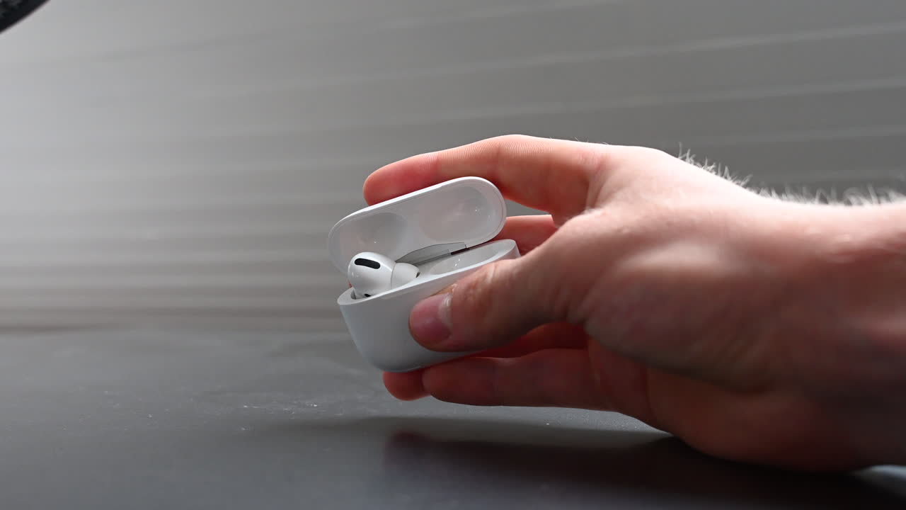 Compact white box containing earphones to listen to music, dopamine source and entertainment