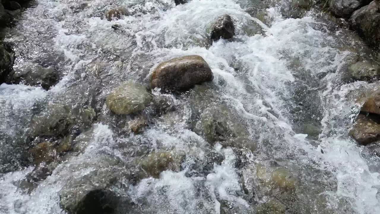 Raging waterfall cascading down mountain is slow motion after days of heavy rain, aerial drone slow part 9, Buttermere, Lake District, UK - lower mountain