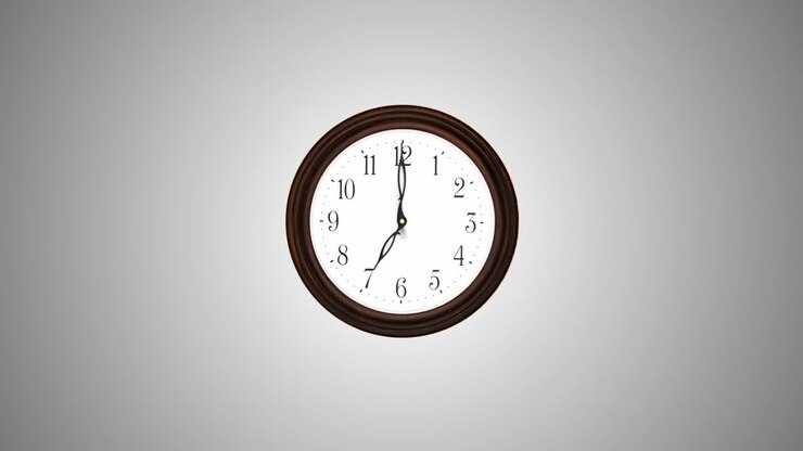 A round clock mounted to the side. Timelapse 4k