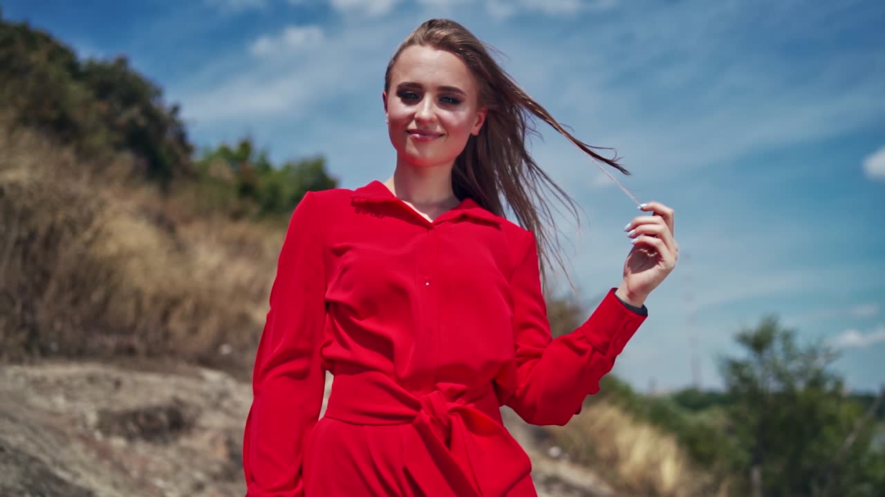 Fashionable woman posing outdoor. Outdoor fashion portrait of young elegant model