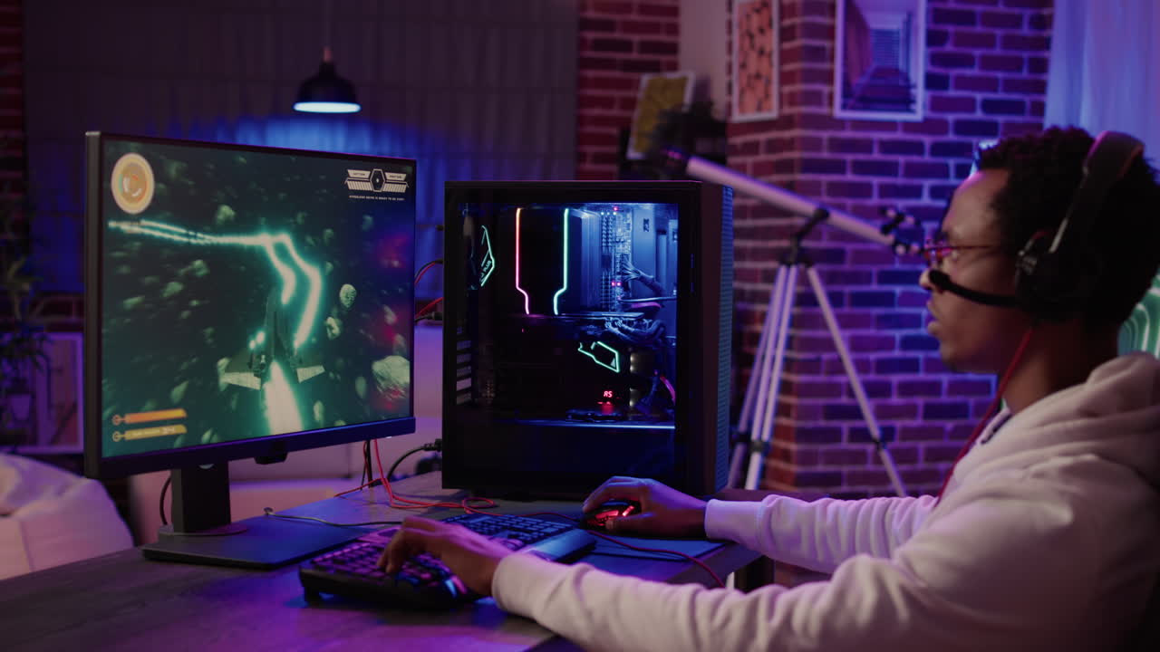 Gamer feeling happy doing victory hand gesture after win in online space shooter on gaming pc