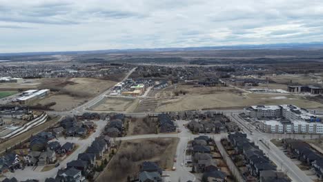 Aerial-view-of-a-modern-suburban-community-in-Calgary,-Canada,-in-spring-after-the-snow-melt