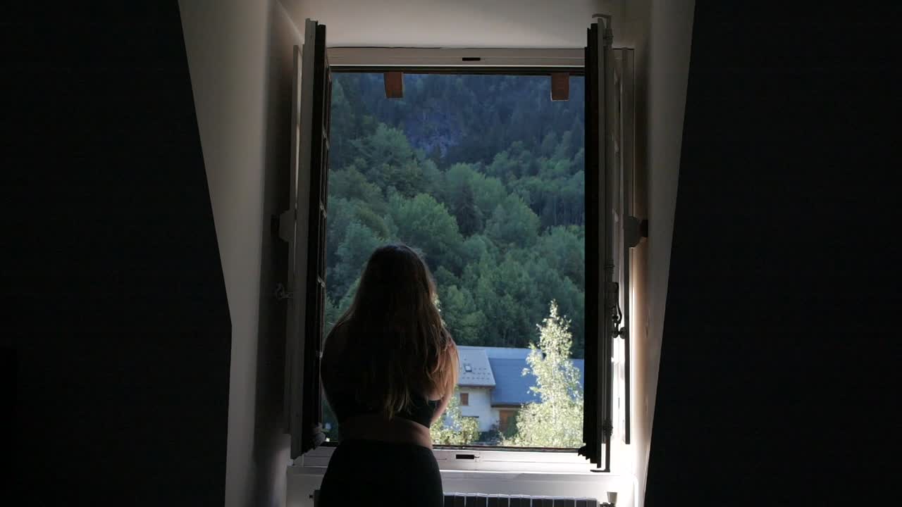 Stunning wide shot of a young Caucasian woman taking in the natural scenery in France