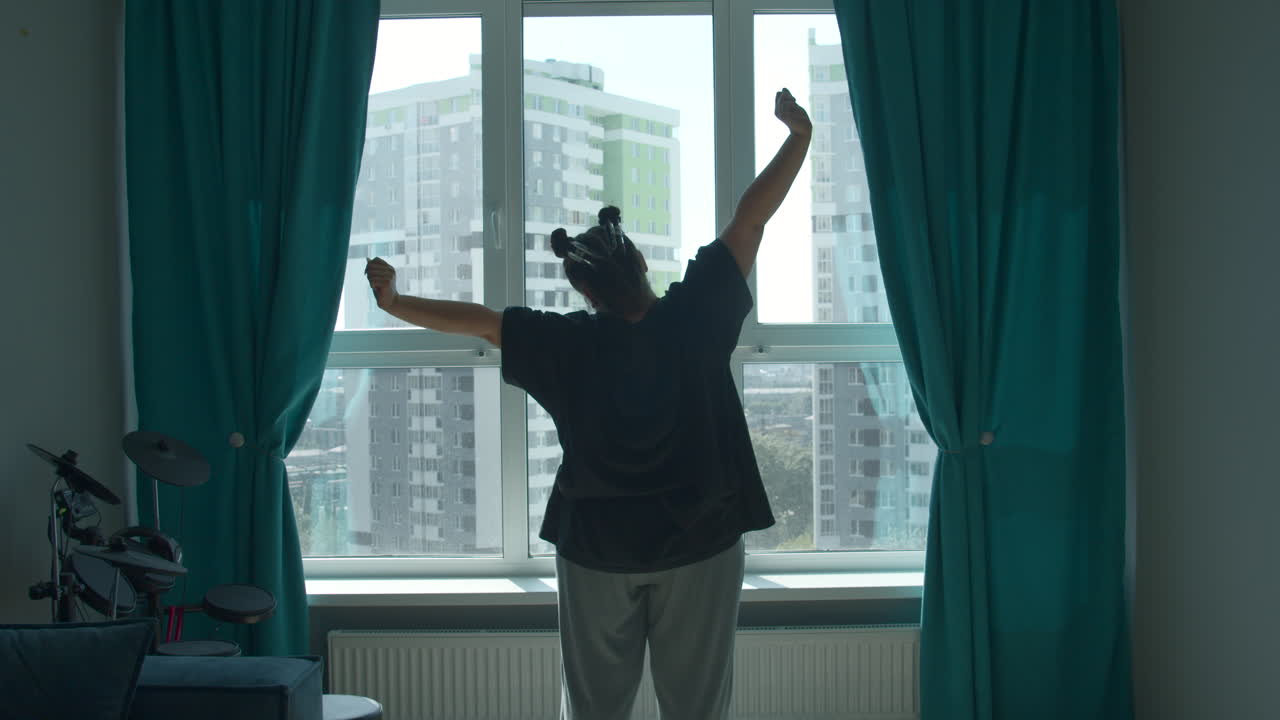 Woman Stretching at Window