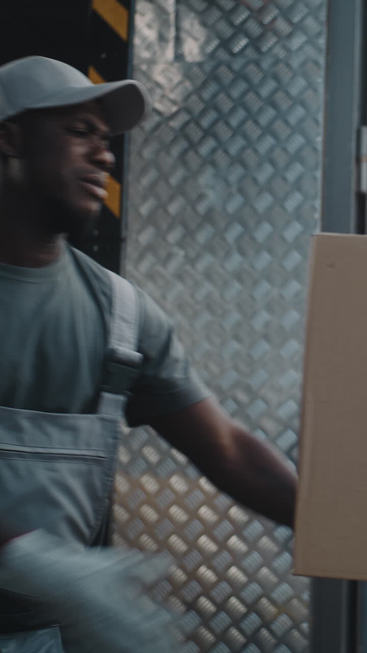 Delivery Worker Struggles with Heavy Package, Gets Assistance