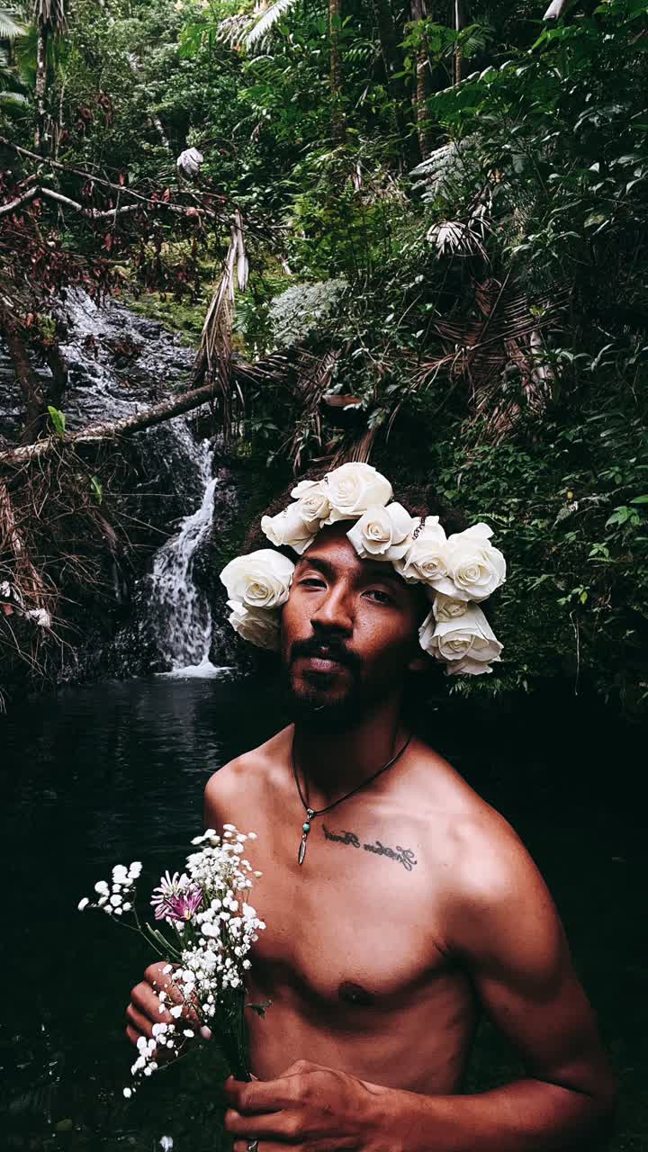 Man with Flower Crown in a Waterfall Forest