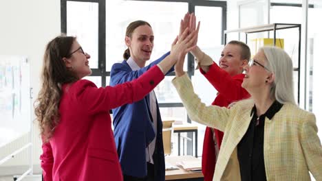 diverse business team celebrating success and applauding in the office