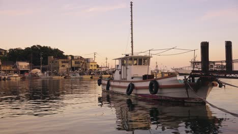 japanese fishing boat, peaceful town of tomonoura at sunset in hiroshima