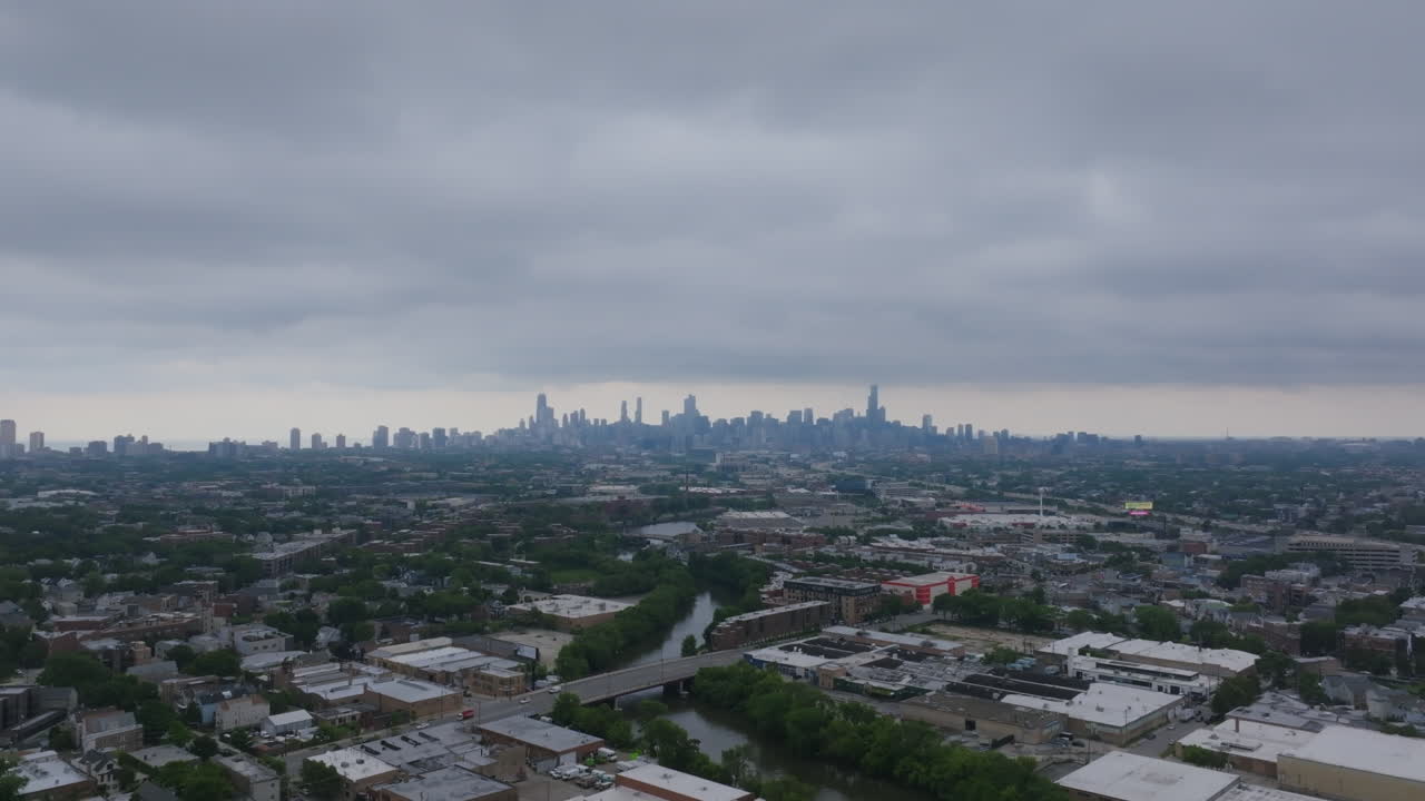 Aerial View of a City Skyline with Urban Landscape and River on an Overcast Day