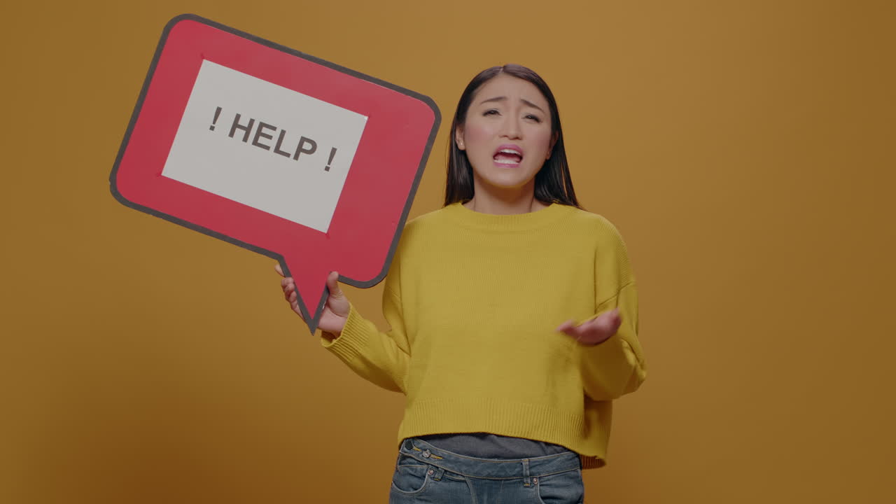 Woman holding speech bubble with text message, asking for help