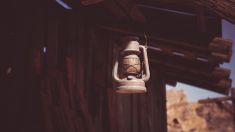 vintage lantern hanging from an old wooden building