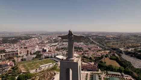 cristo rei, sanctuary of christ the king, against almada cityscape