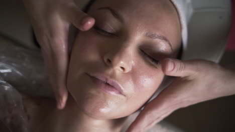 woman receiving a facial massage