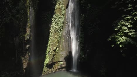 stunningly beautiful sekumpul waterfall in deep jungle chasm on bali