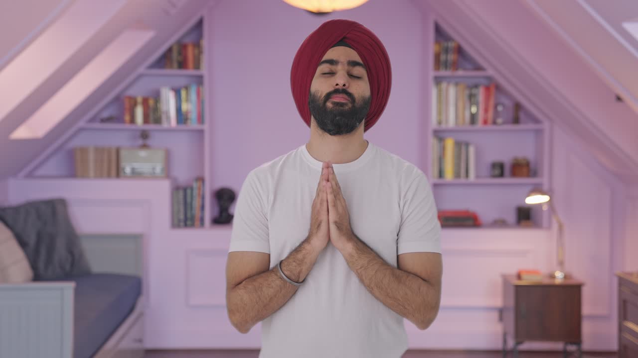 Religious Sikh Indian man praying to God