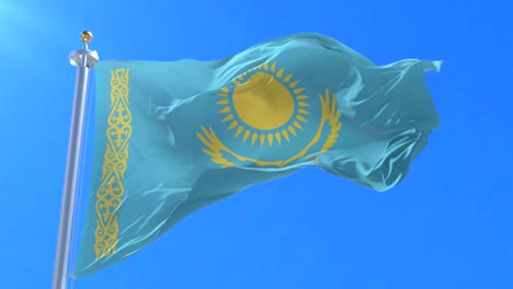 bandera de kazajstán ondeando en el viento con el cielo azul en lento, bucle