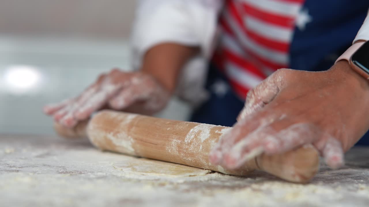 Making dough with an American flag apron